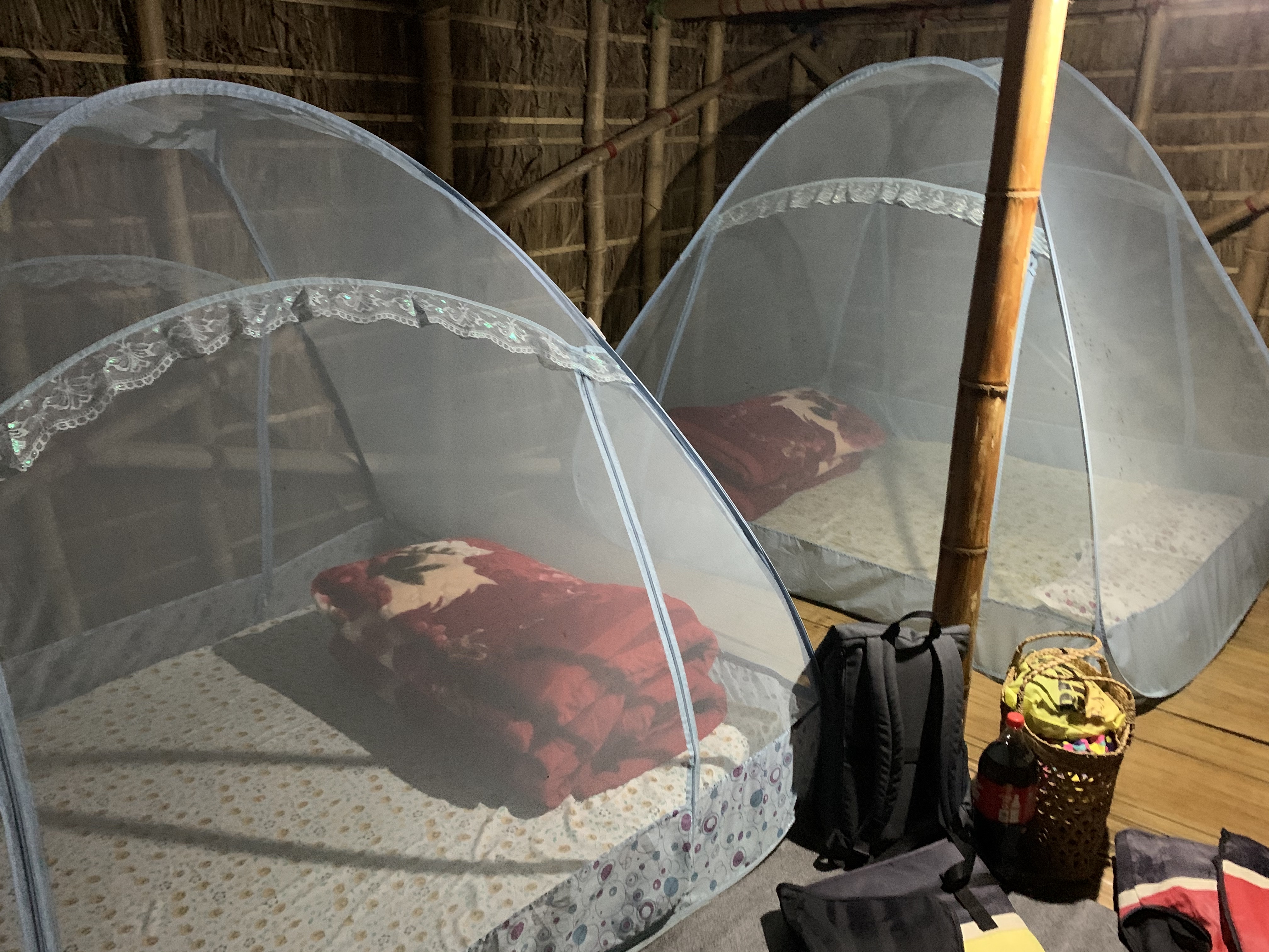 Sleeping arrangements complete with mosquito nets inside the floating huts