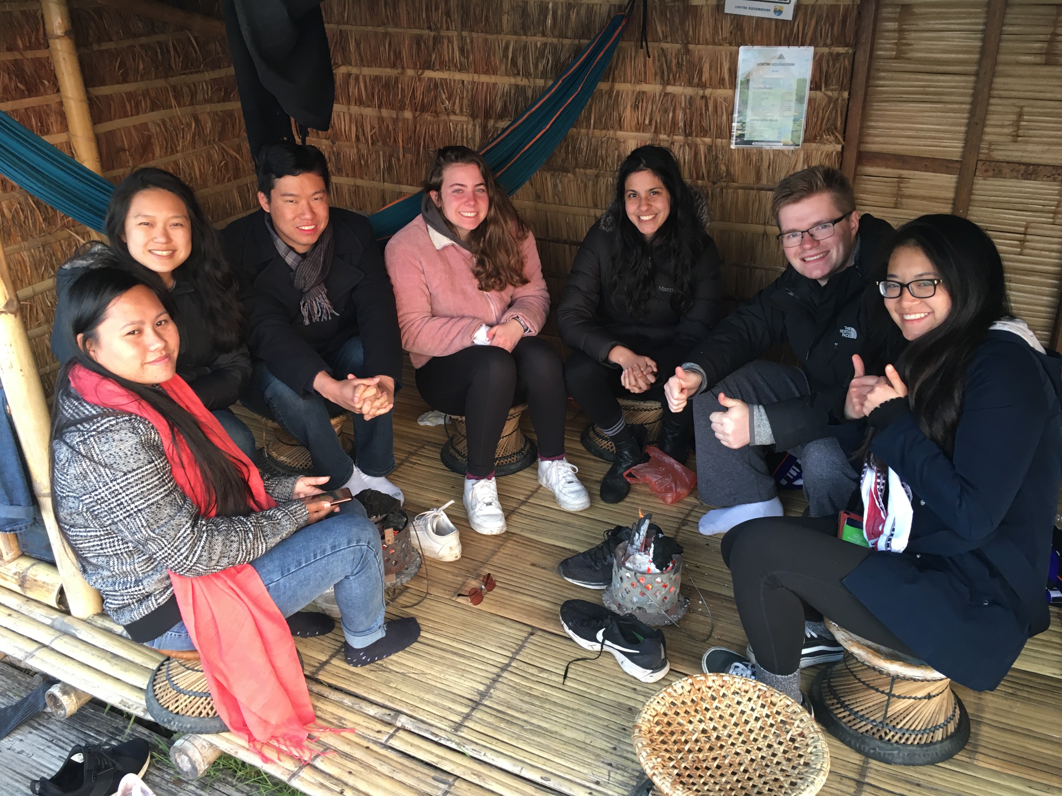 Enjoying the warmth of a traditional coal heater (meiphu)