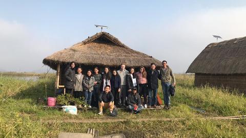 PSIL '20 team photo in front of floating hut