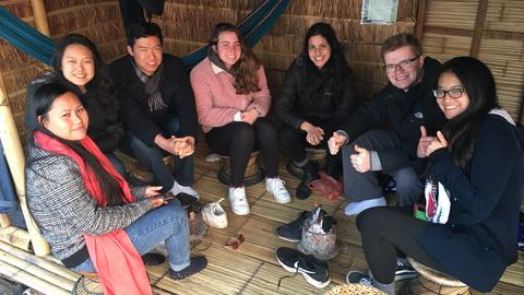 Enjoying the warmth of a traditional coal heater (meiphu)
